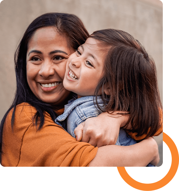 02 A woman and child hugging each other.
